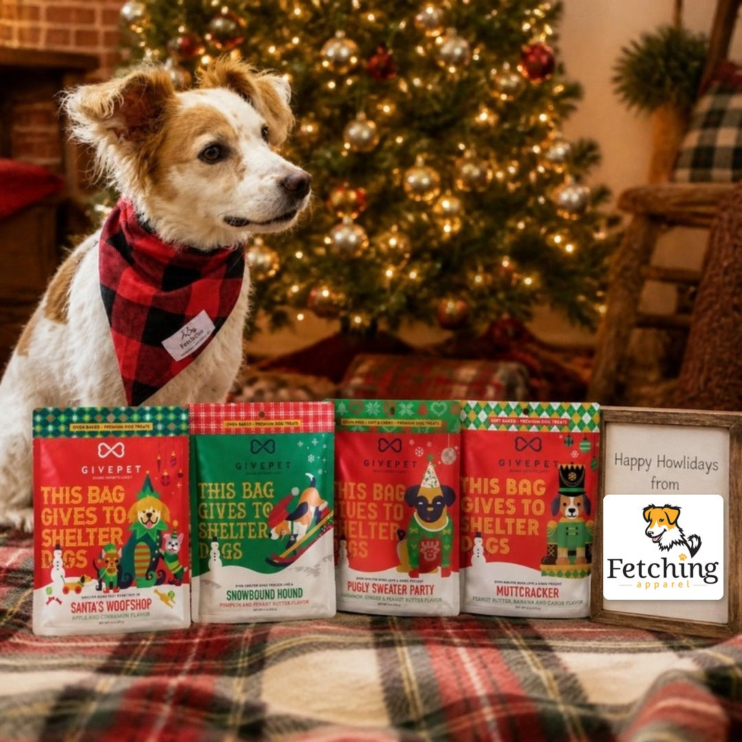 Fetching Apparel's mascot pup in a buffalo plaid bandana by a Christmas tree with all four holiday dog treat bags and a sign with the Fetching Apparel logo