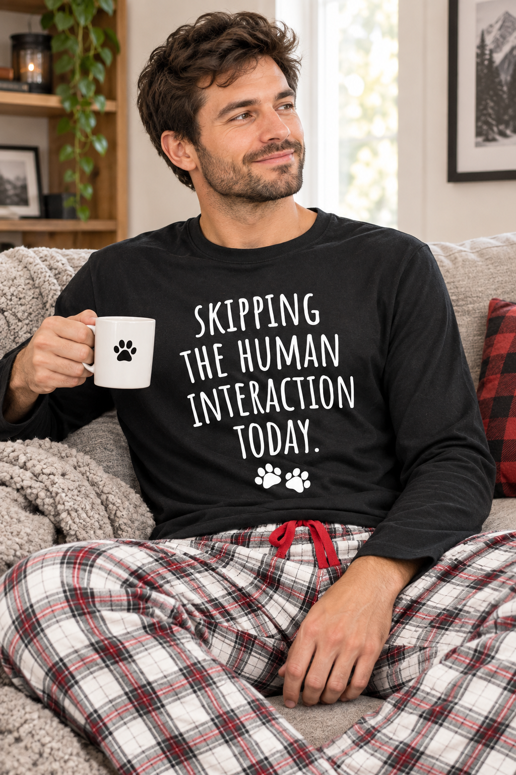 Black long-sleeve T-shirt with “SKIPPING THE HUMAN INTERACTION TODAY” text and paw prints