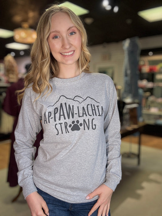 Heather gray long-sleeve T-shirt with AP-PAW-LACHIA STRONG chest graphic, worn