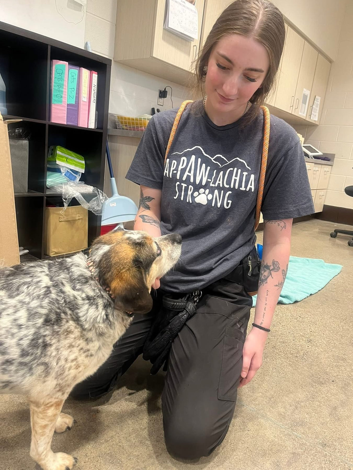 Charcoal gray crewneck T-shirt with Ap-PAW-lachia STRONG mountain dog paw graphic