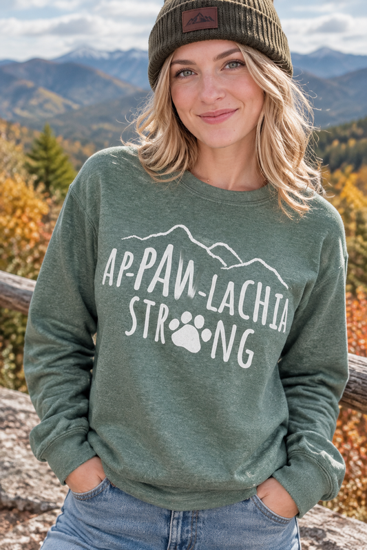 Basil green crewneck sweatshirt with white paw-and-mountain logo graphic