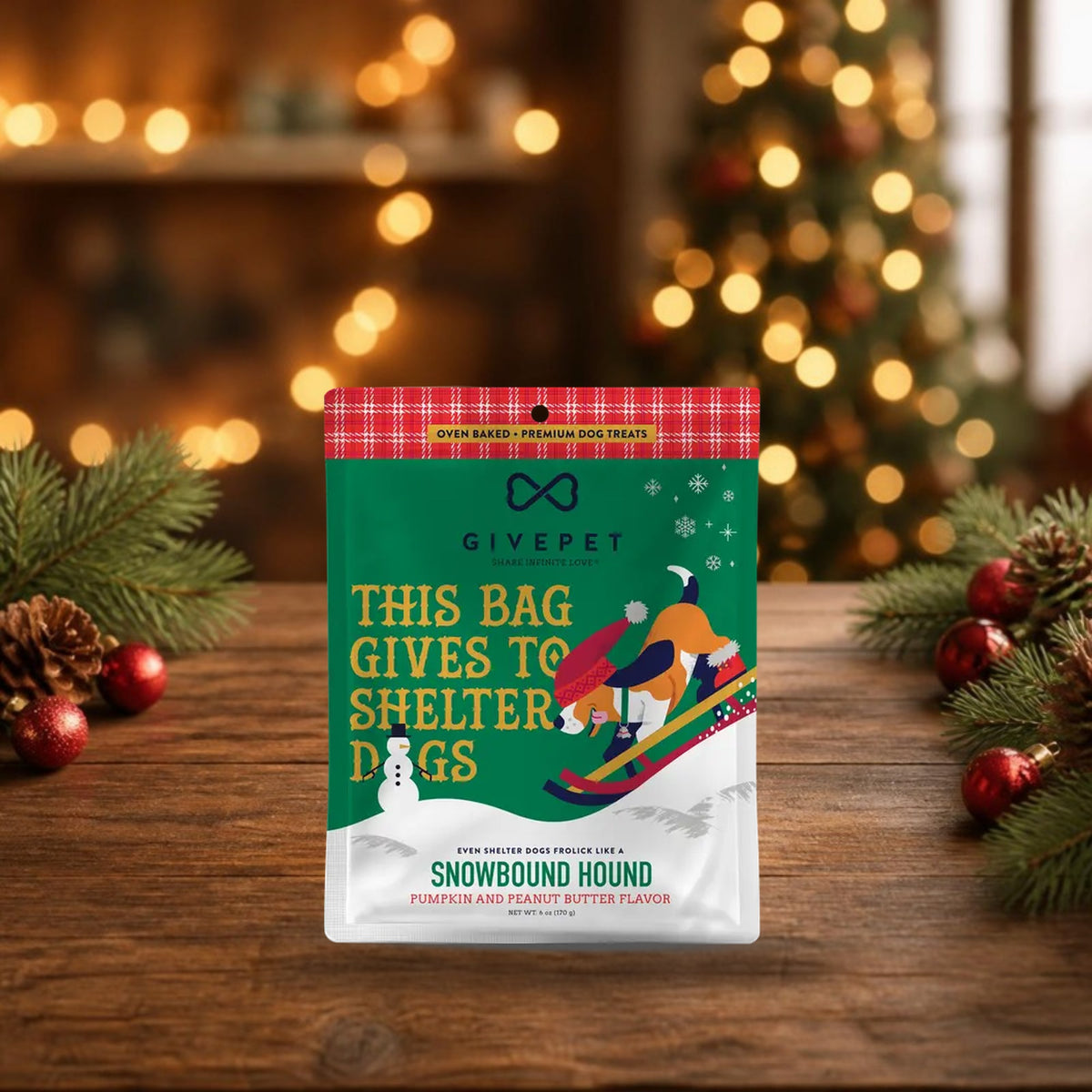 Snowbound Hound pumpkin and peanut butter baked dog biscuits, 6 oz holiday bag on a festive wooden table